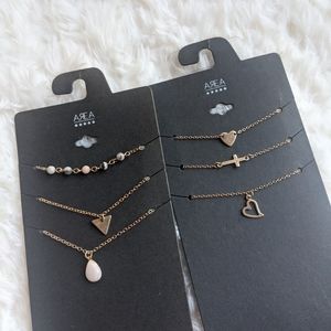 AREA STARS 2 Sets of 3 Layered Necklaces